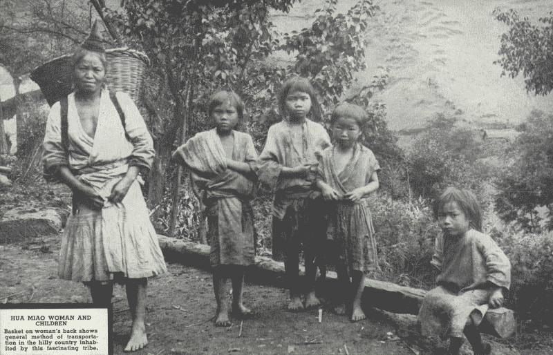 HUA MIAO WOMEN AND CHILDREN

Basket on woman's back shows general method of transportation in the
hilly country inhabited by this fascinating tribe.