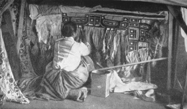 CHILCAT WOMAN WEAVING A BLANKET