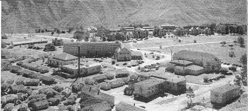 From a bluff just north of the community the buildings of Mammoth Hot Springs are spread before the camera. This is the administration center for Yellowstone Park, and, with the tourist facilities, comprises a small town in itself.